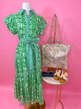 Green patterned dress with green stripe pattern on the button-down detail with tie waist