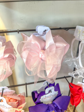 Large pink layered bow