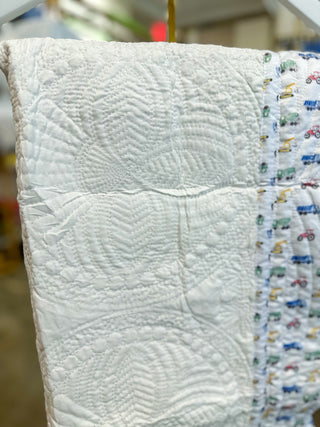 White W/ Truck Print Trim Baby Quilt