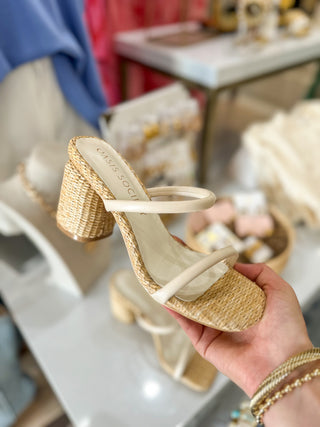 Beige high-heeled sandals with woven design and two cream straps