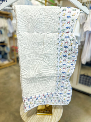 White W/ Truck Print Trim Baby Quilt