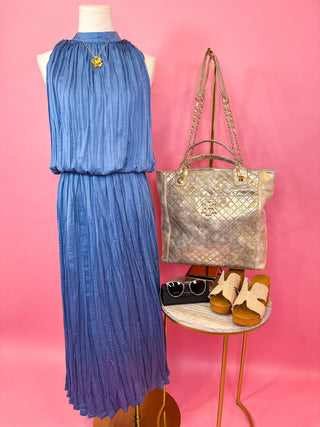 Sleeveless maxi dress with a high neckline, elastic waist, and allover soft pleating