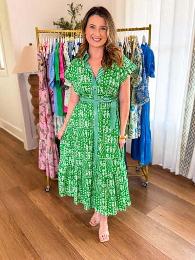 Green patterned dress with green stripe pattern on the button-down detail with tie waist