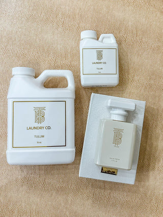 Thomas blonde scent Tulum in 16 and 4oz bottle of laundry detergent and the perfume.